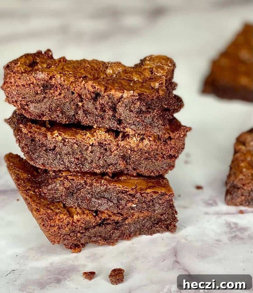 Fudgy Nutella Brownies with Salted Caramel Drizzle 7 Tall stack of brownies.