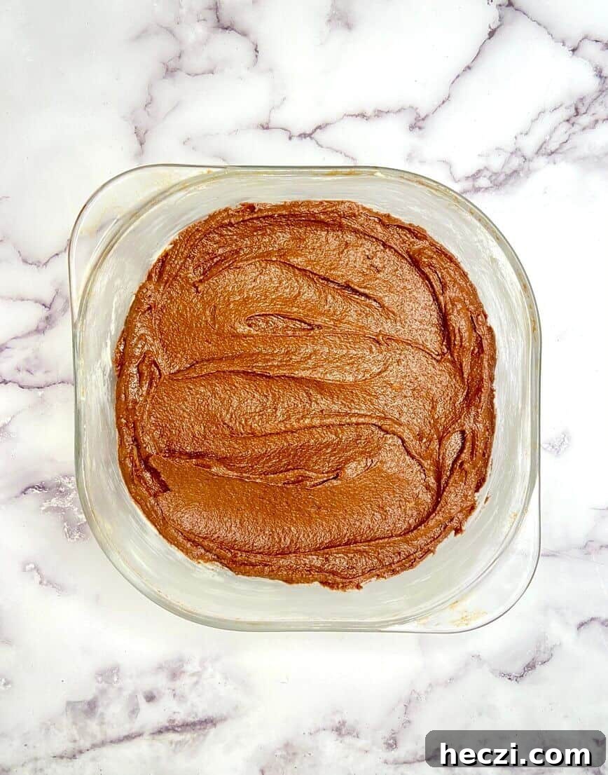 Fudgy Nutella Brownies with Salted Caramel Drizzle 9 Brownie batter in baking pan.