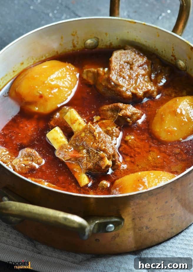 Aloo Gosht: Tender Lamb Curry with Potatoes Recipe 12 Instant pot aloo gosht served in copper vessel
