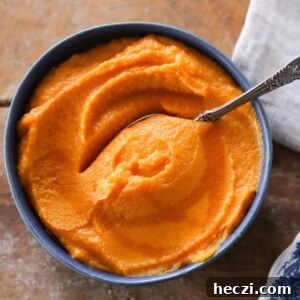Maple-Glazed Mashed Sweet Potatoes with Cinnamon 5 Maple Mashed Sweet Potatoes in blue bowl.