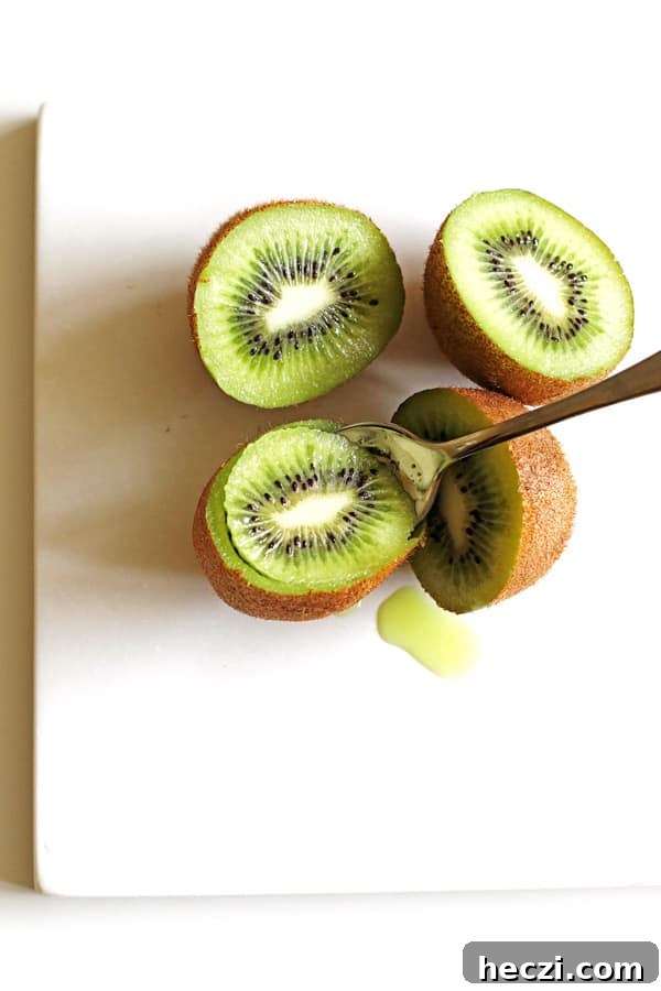 Refreshing Fruit Smoothie Recipes for Energy and Flavor 4 Scooping out the green kiwi using a spoon