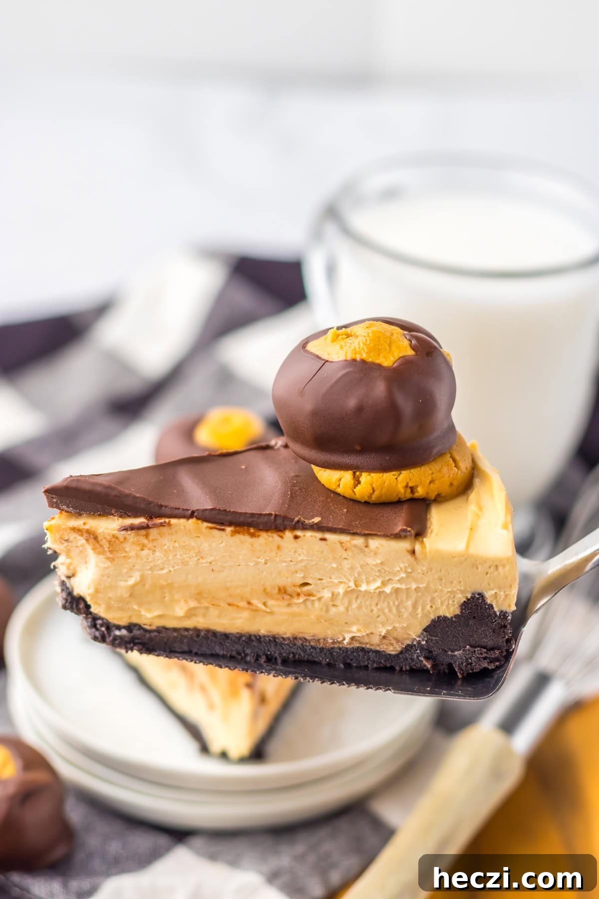 spatula holding a slice of Buckeye Cheesecake