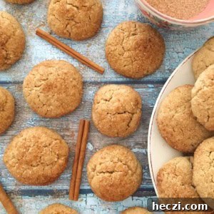Snickerdoodles on a wood board with cinnamon sticks