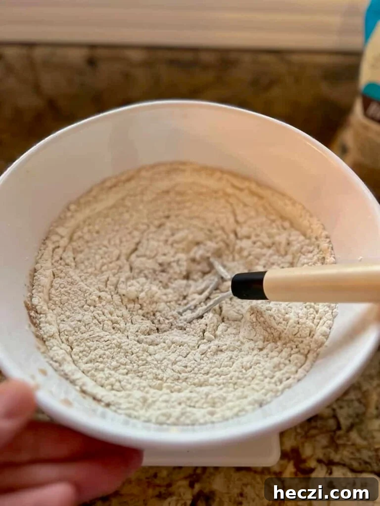 Top Gifts for Sourdough Bakers: 30+ Ideas They'll Love 21 Danish dough whisk mixing sourdough dough in a bowl.