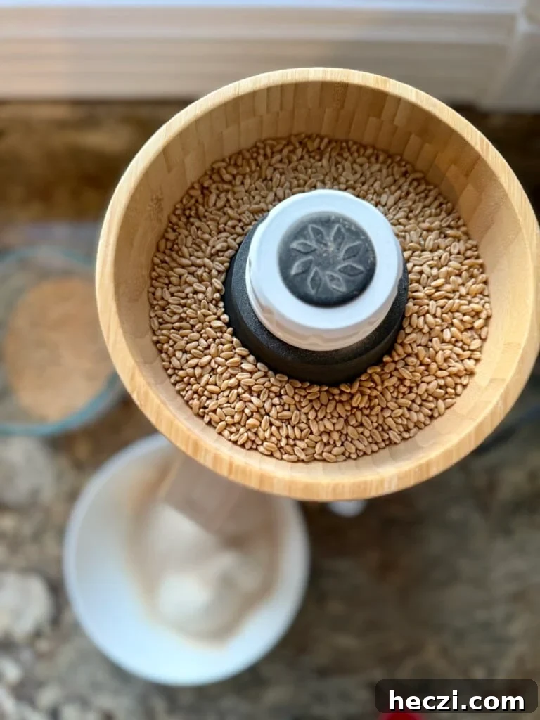 Top Gifts for Sourdough Bakers: 30+ Ideas They'll Love 24 Grain mill with wheat berries in the hopper ready to be freshly milled.