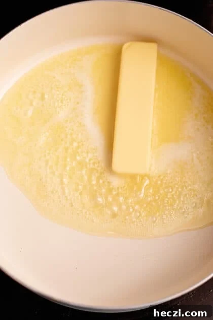 Melt butter in skillet.