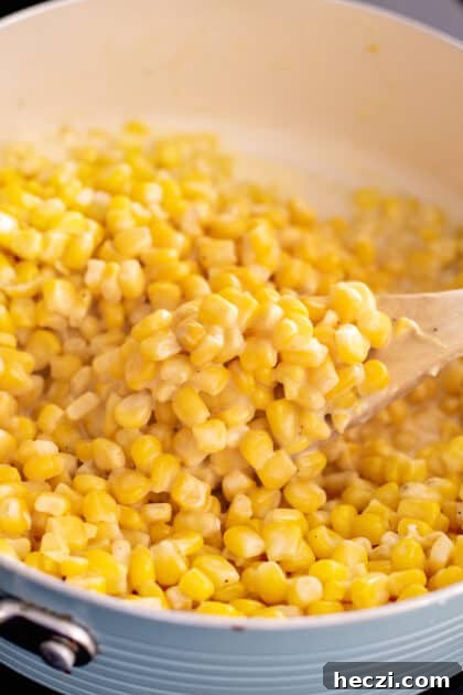 Stir together corn and butter until thawed.