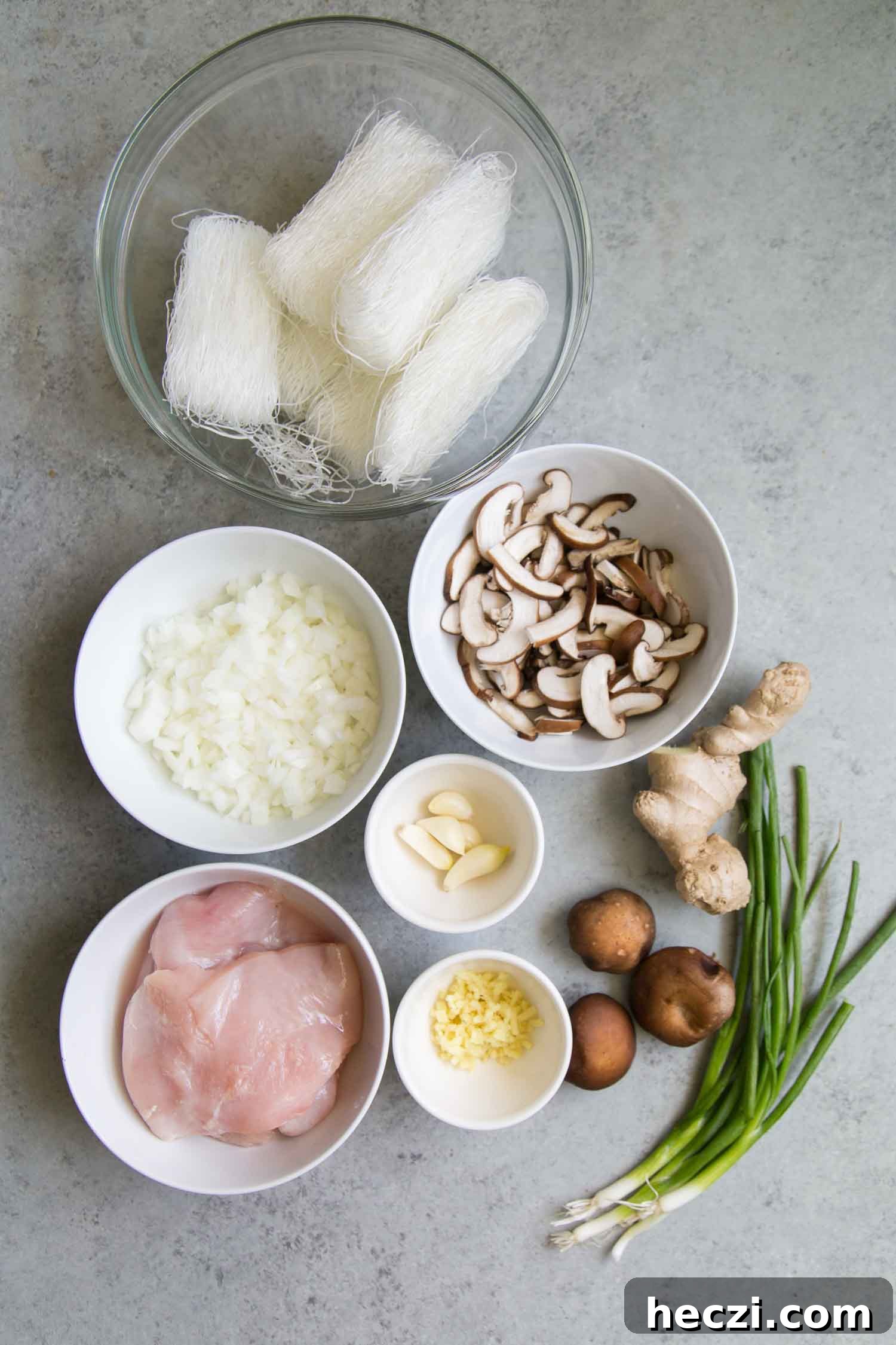Filipino Chicken Sotanghon Noodle Soup Recipe 3 Chicken Sotanghon Soup ingredients include mung bean noodles, chicken, onion, garlic, and mushrooms.
