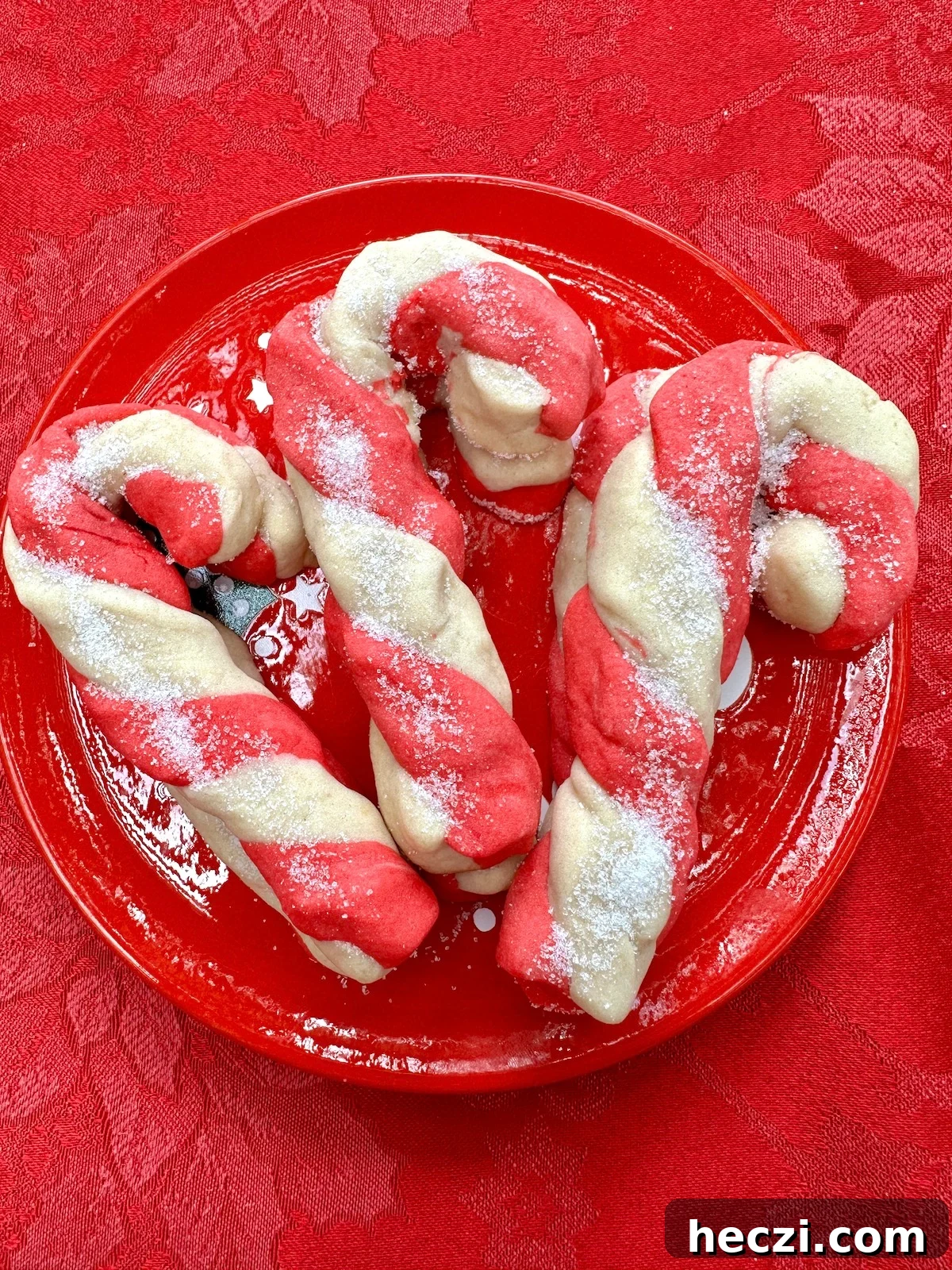 Peppermint Candy Cane Cookies Recipe for Festive Holidays 17 Candy cane cookies on a plate.