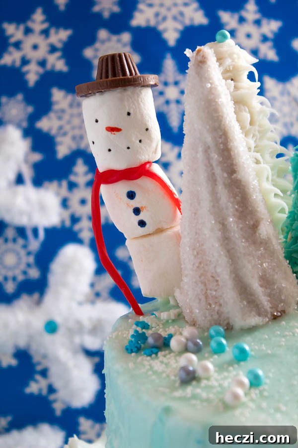 Marshmallow snowmen on a cake