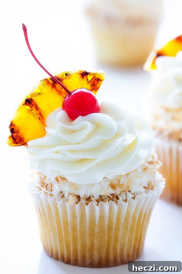 Pina Colada Cupcakes Recipe with Coconut Rum Glaze 4 Pina Colada Cupcakes via Bakers Royale