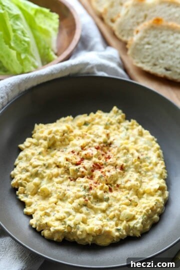 Bowl of dill pickle egg salad in gray bowl.