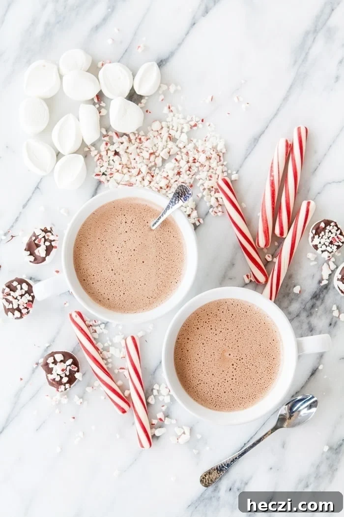 two mugs of peppermint spiked hot chocolate