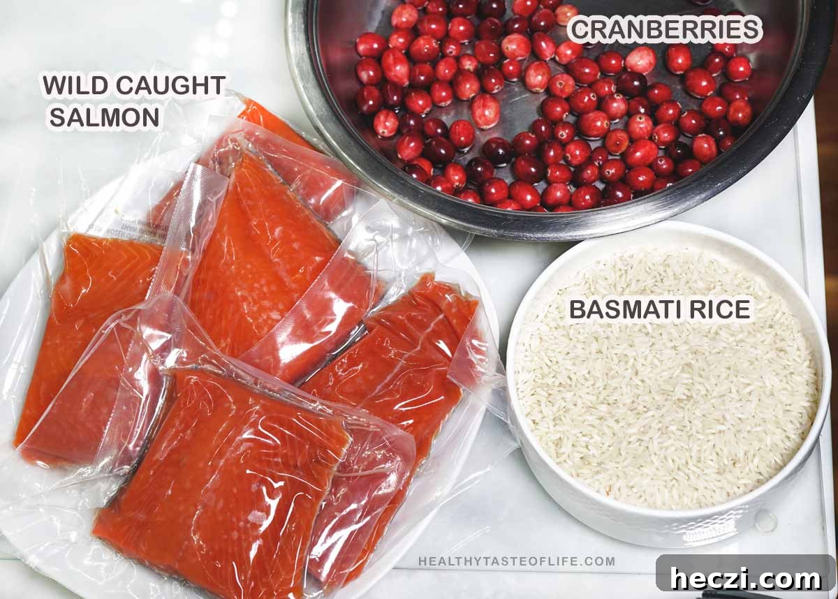 Ingredients salmon, rice, cranberries on the table,