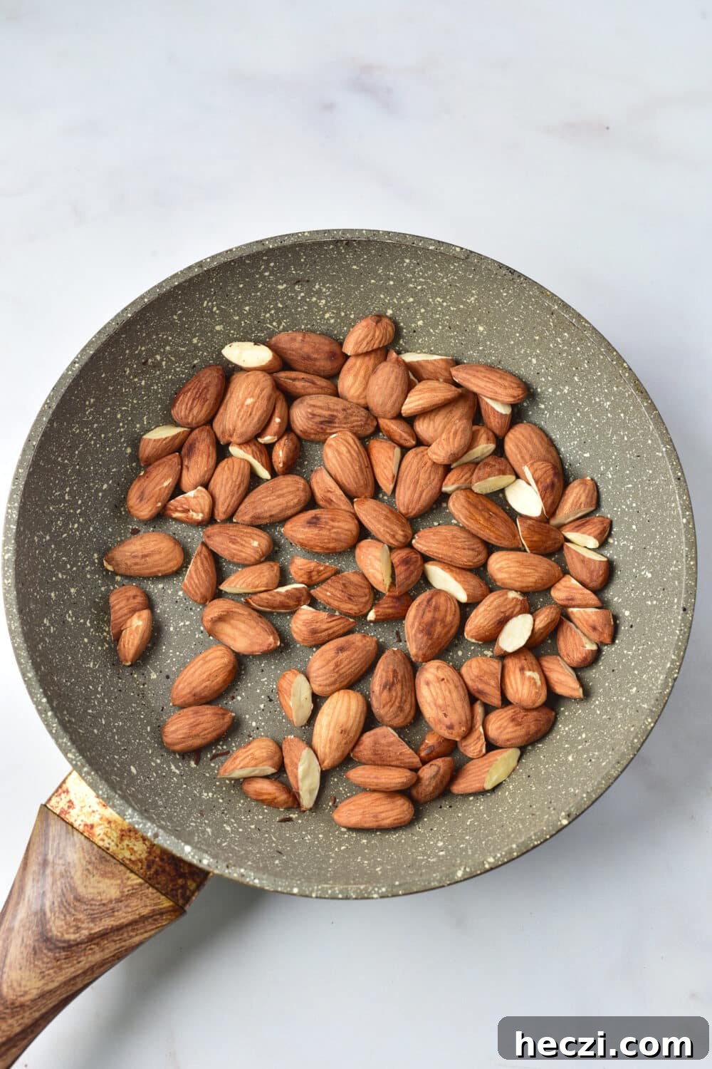 White Chocolate Almond Bark Recipe: Quick No-Bake Treat 4 almonds toasting in skillet