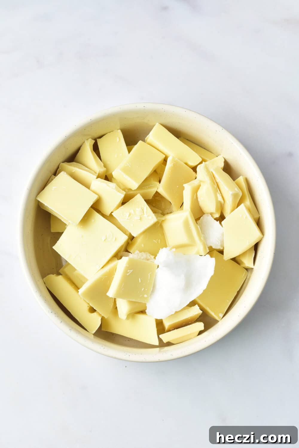 White Chocolate Almond Bark Recipe: Quick No-Bake Treat 5 white chocolate pieces and coconut oil in a bowl