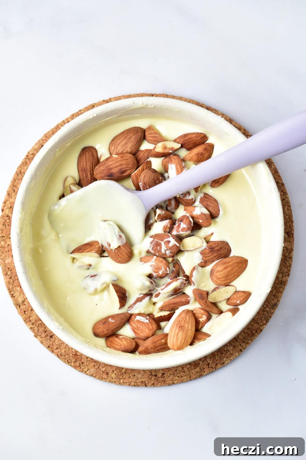 White Chocolate Almond Bark Recipe: Quick No-Bake Treat 8 melted white chocolate and almonds in a bowl