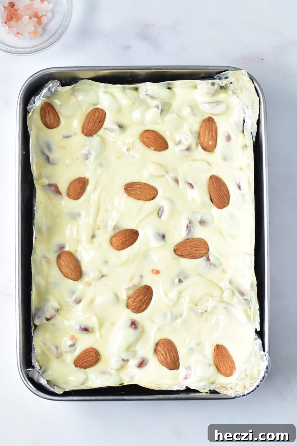 White Chocolate Almond Bark Recipe: Quick No-Bake Treat 9 Keto White Chocolate Almond Bark in a pan ready for freezer or fridge