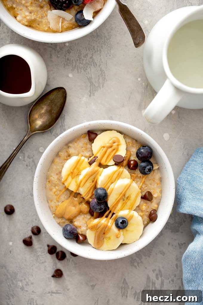 Creamy Instant Pot Steel-Cut Oats Recipe for Busy Mornings 7 Oatmeal topped with bananas, chocolate chips, blueberries and peanut butter