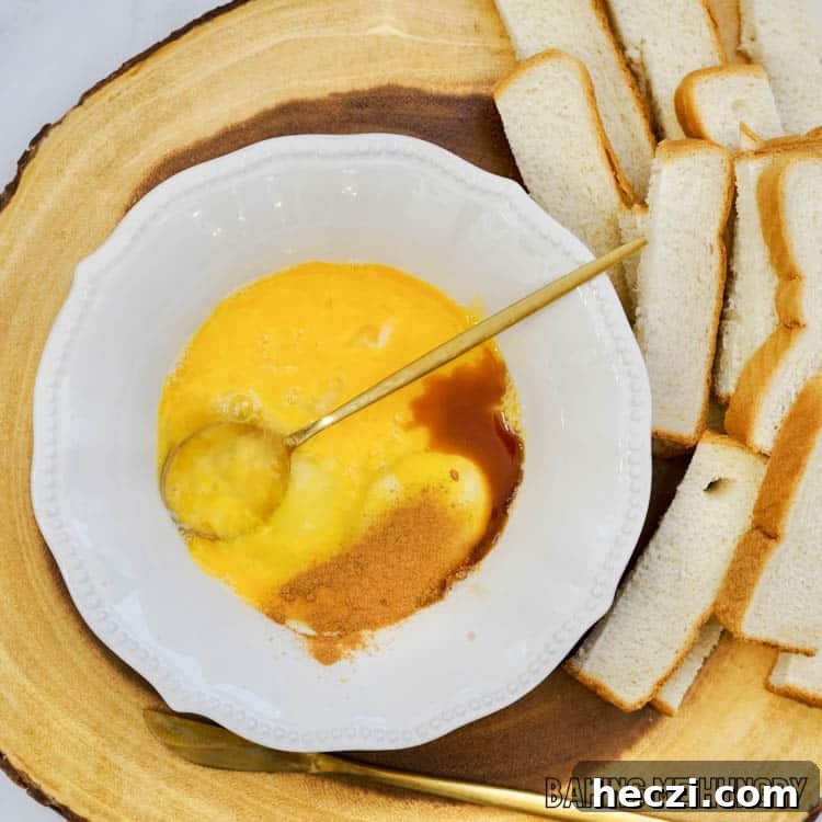 bowl with beaten eggs and cinnamon