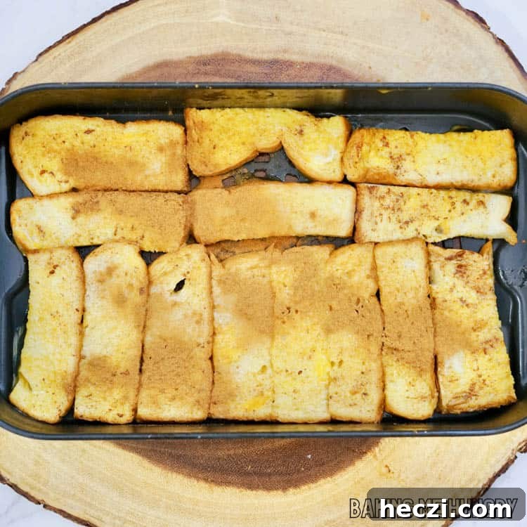 air fryer basket lined with prepped french toast sticks
