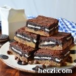 Decadent Homemade Slutty Brownies Recipe 7 a large arrangement of slutty brownies on a black and white plate