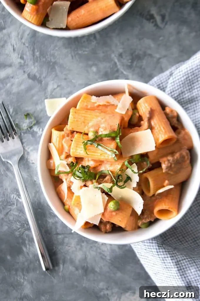Rustic Sausage Rigatoni with Creamy Tomato Sauce 10 country-style rigatoni and a fork