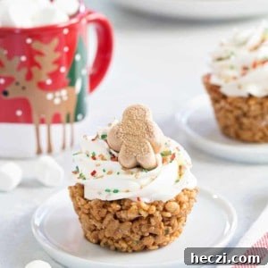 Gingerbread Marshmallow Treat Cupcakes are an adorable and delicious addition to any holiday dessert plate! Festive sprinkles make and mini gingerbread marshmallows make them merry and bright
