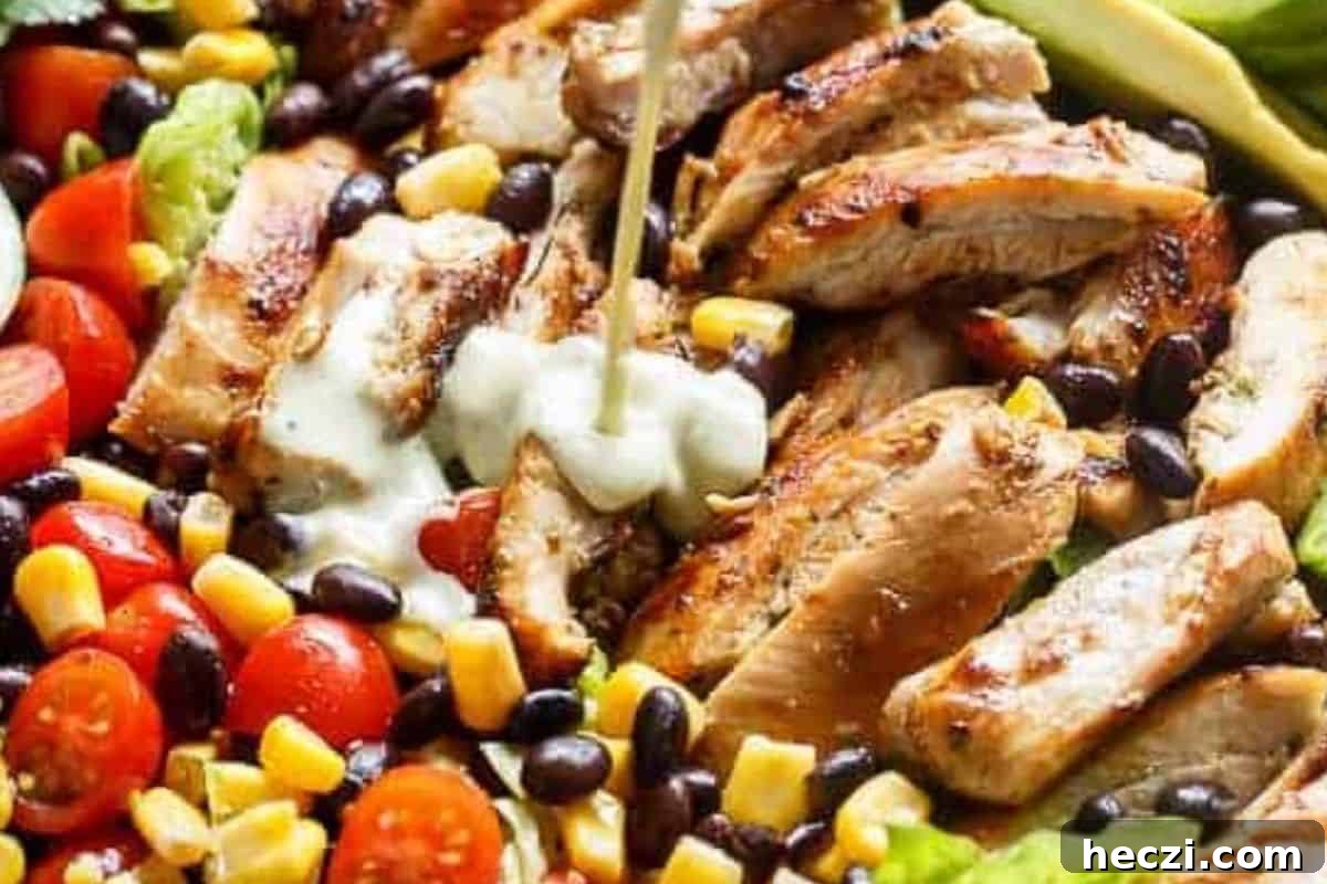 Southwestern Chicken Salad Recipe: Zesty Ingredients & Creamy Avocado 10 Drizzle the creamy chili lime dressing generously over the top and add the sliced chicken on top.