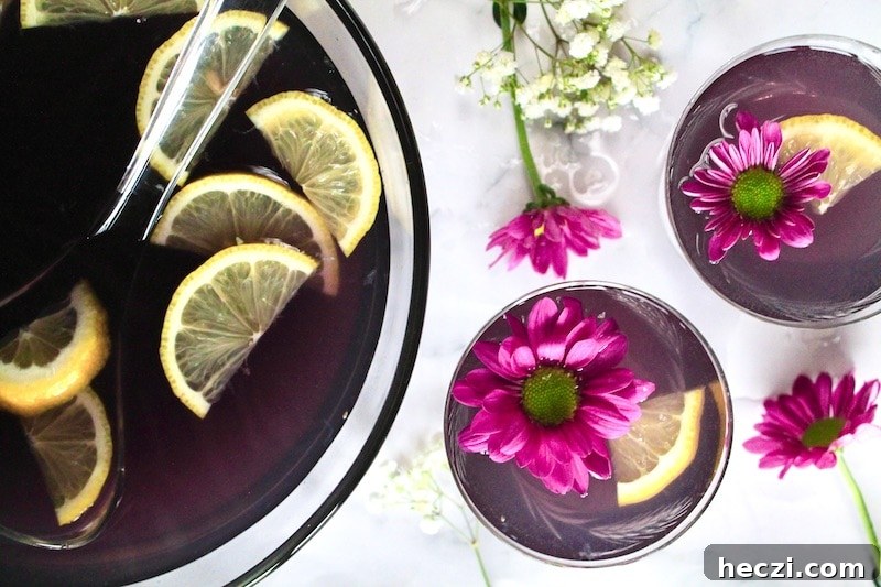 combine gin blue curacao simple syrup and strawberry lemonade in a punch bowl.