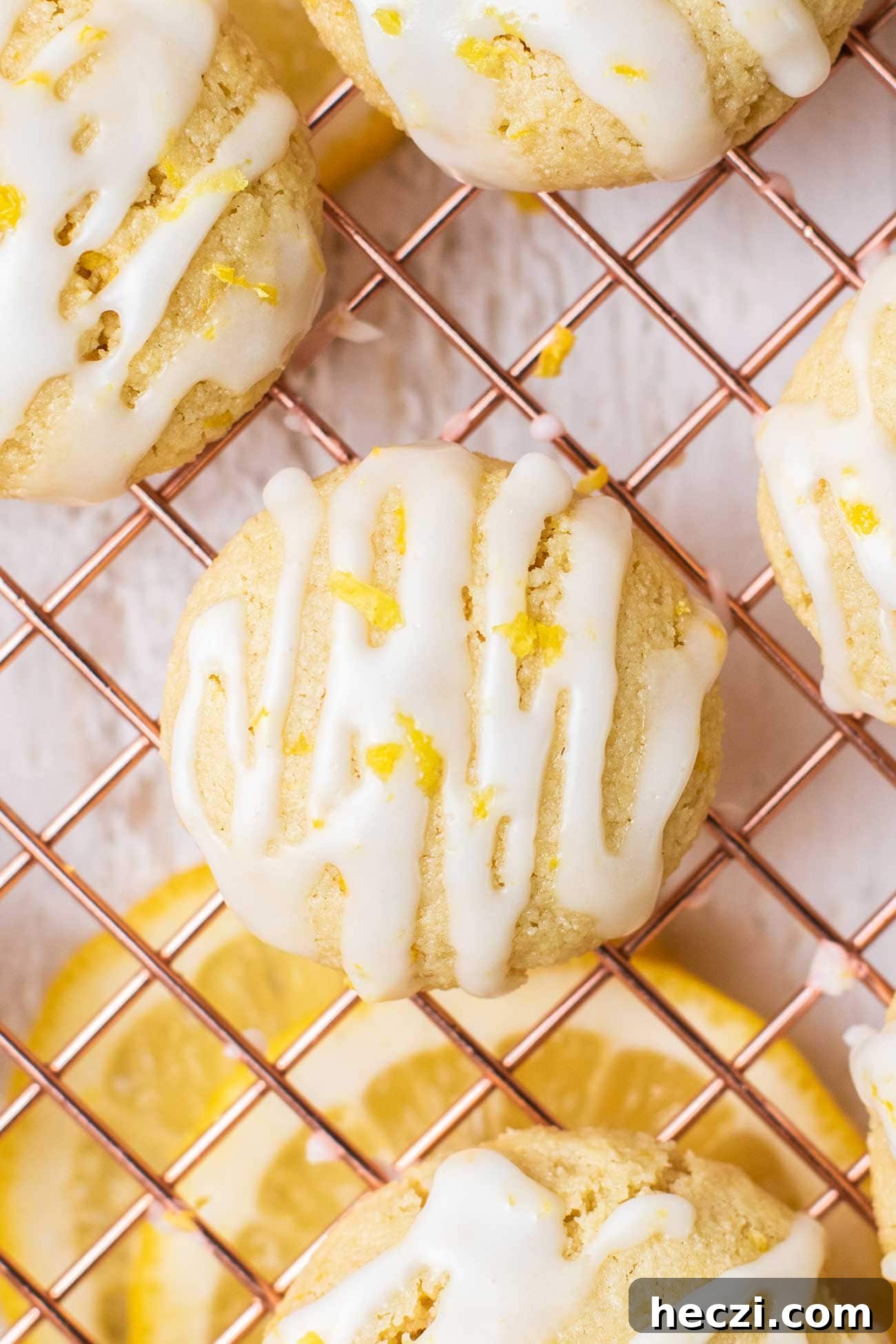 Chewy Lemon Cookies (Gluten-Free, Dairy-Free) 2 A close up look at a lemon cookie drizzled with a lemon glaze.