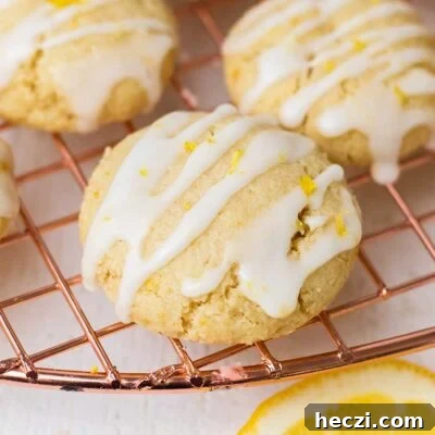Chewy Lemon Cookies (Gluten-Free, Dairy-Free) 8 A lemon cookie shown drizzled with a lemon glaze.