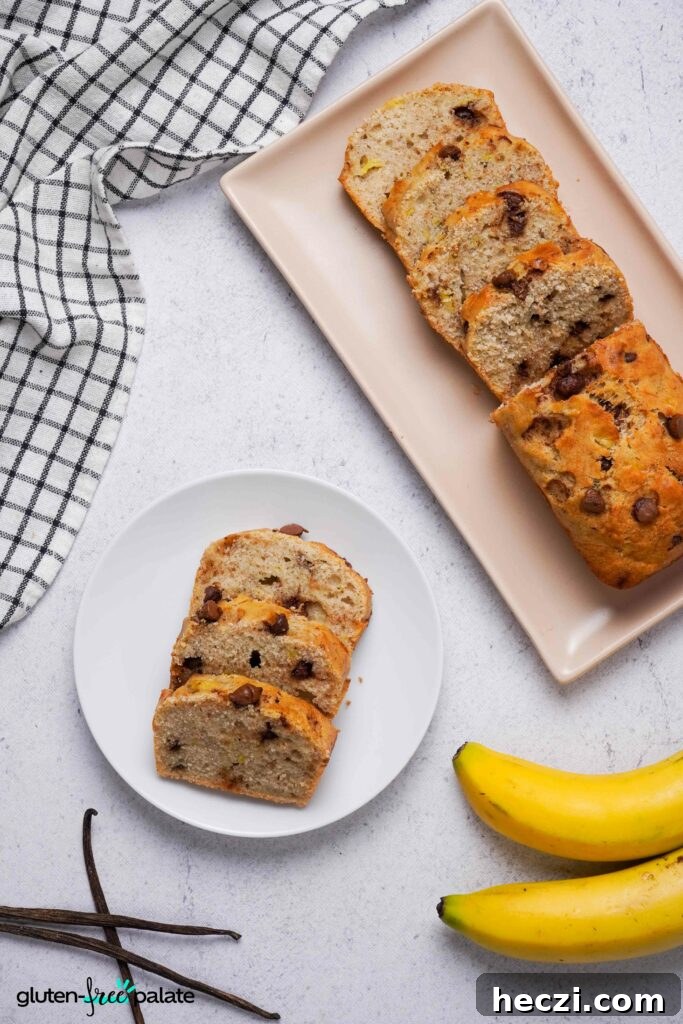 Sliced gluten-free banana bread on a side plate next to the full loaf, made with certified gluten-free butter