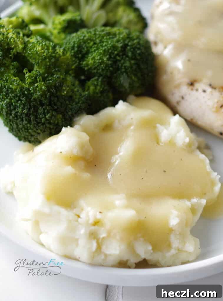 Gluten-free mashed potatoes topped with gravy, made with certified gluten-free butter for a celiac-safe side dish