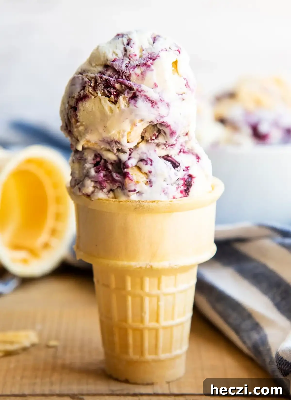 ice cream cone with blueberry pie ice cream scoops. 