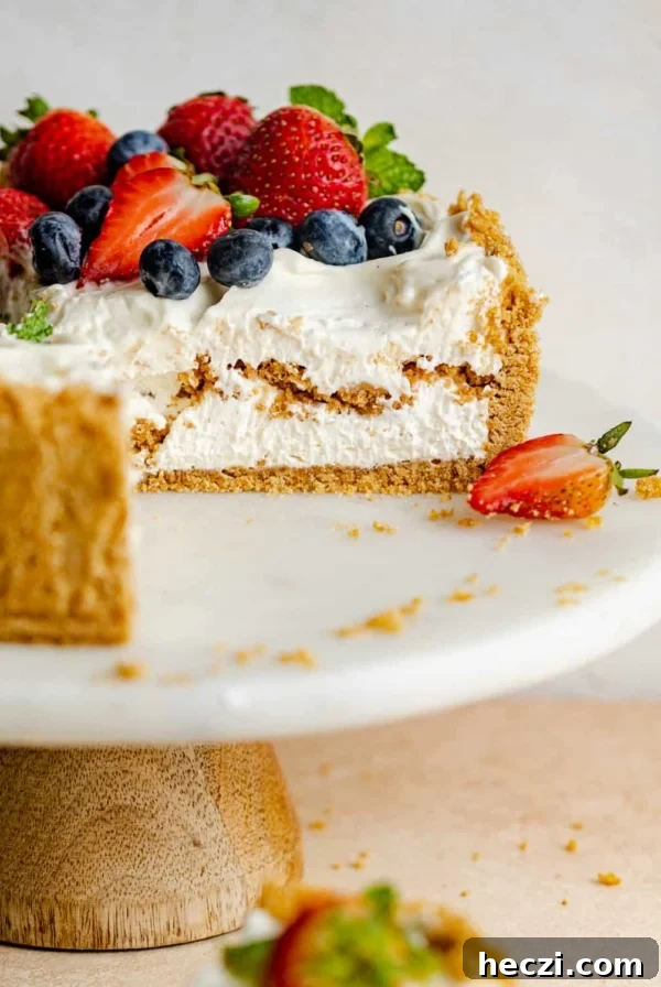 philadelphia no bake cheesecake on a cake stand.