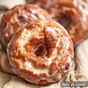 old fashioned sour cream donuts on a beige cloth.