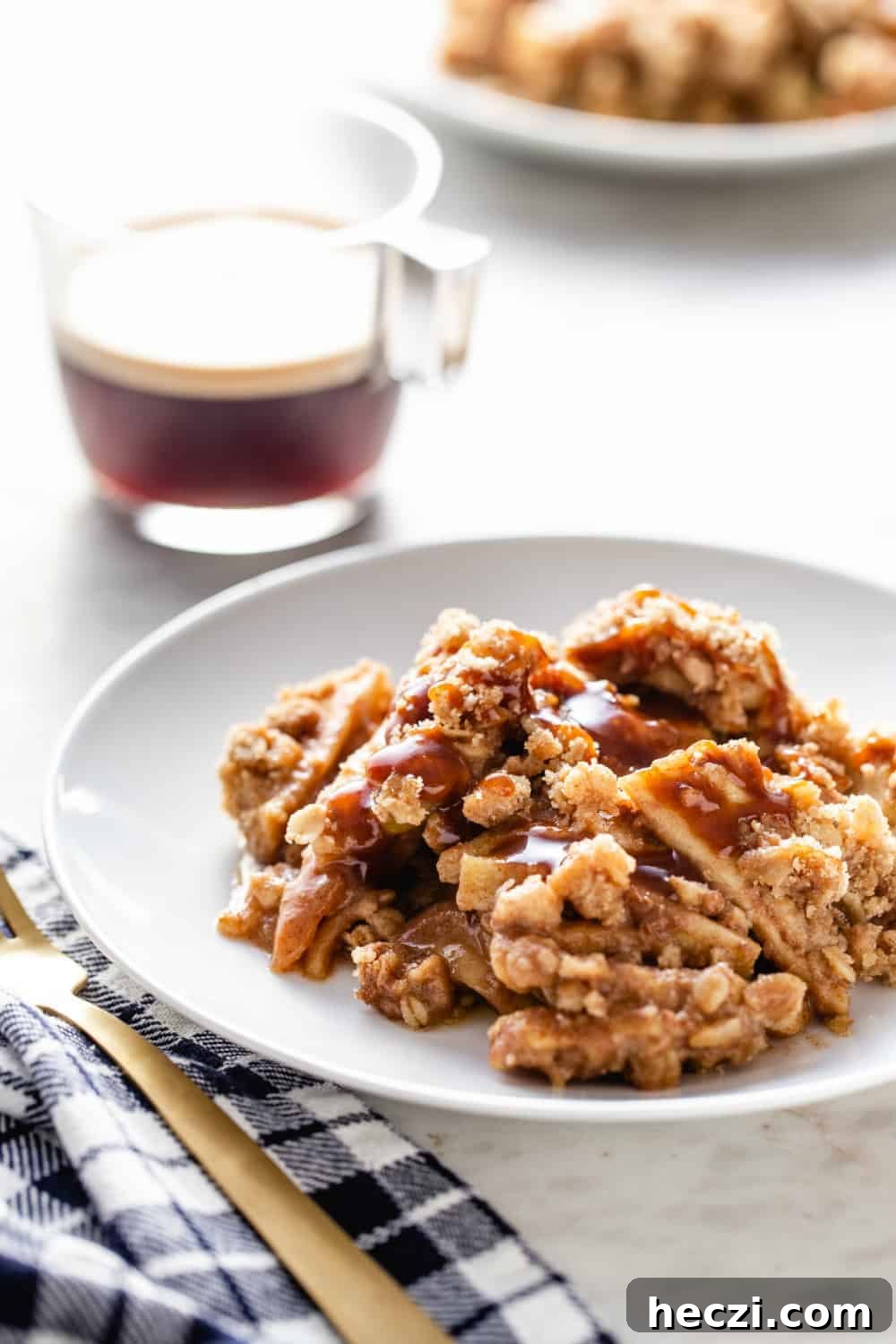 Warm Caramel Apple Crisp with Crunchy Oat Topping 7 Plate of caramel apple crisp next to a cup of espresso