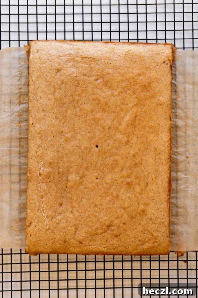 sheet cake on a wire cooling rack lined with parchment