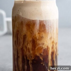 Starbucks Pumpkin Cream Cold Brew Review: Flavor, Price & Tips 10 Pumpkin cream cold brew in a glass