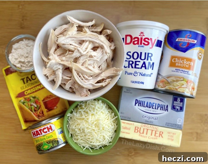 Creamy White Chicken Enchiladas Recipe for Comforting Dinner 3 Homemade White Chicken Enchiladas -- The BEST quick and easy family dinner recipe made with rotisserie chicken, cream cheese and sour cream. So yummy!