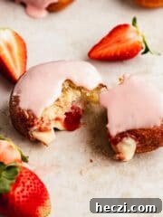 torn apart strawberry and custard filled donut