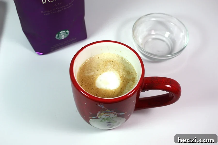 Homemade Holiday Spice Flat White Recipe 2 Copycat Holiday Spice Flat White coffee in a Christmas mug.