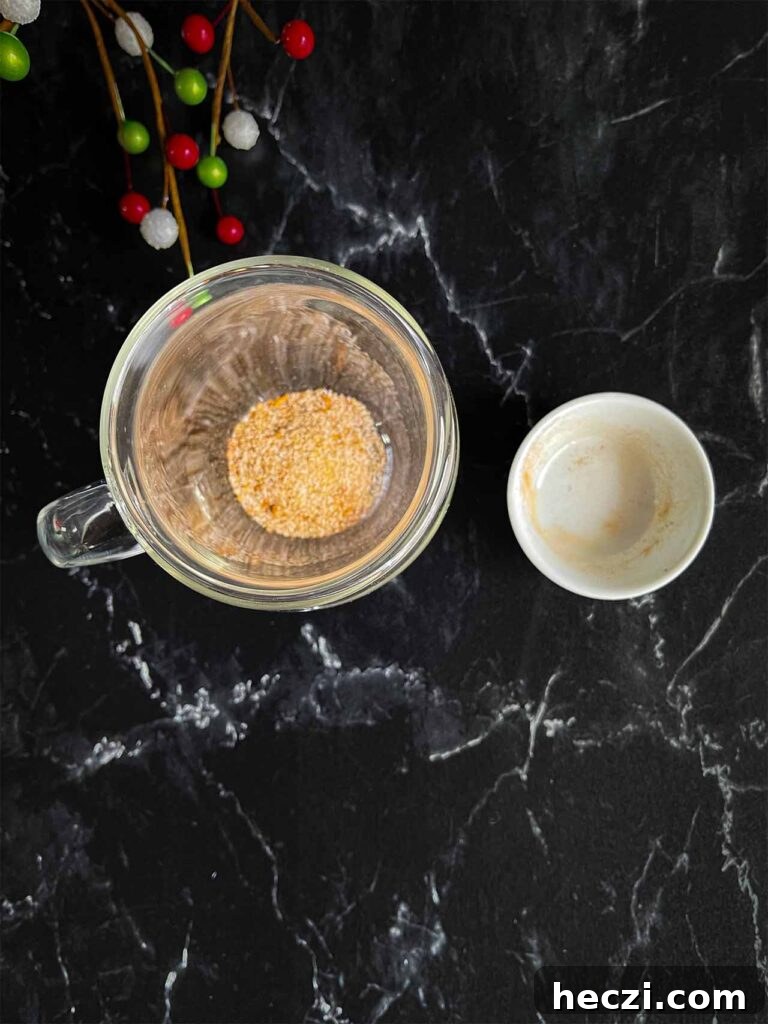 Homemade Holiday Spice Flat White Recipe 5 Holiday spice flat white spice mixture in the bottom of a glass coffee mug.