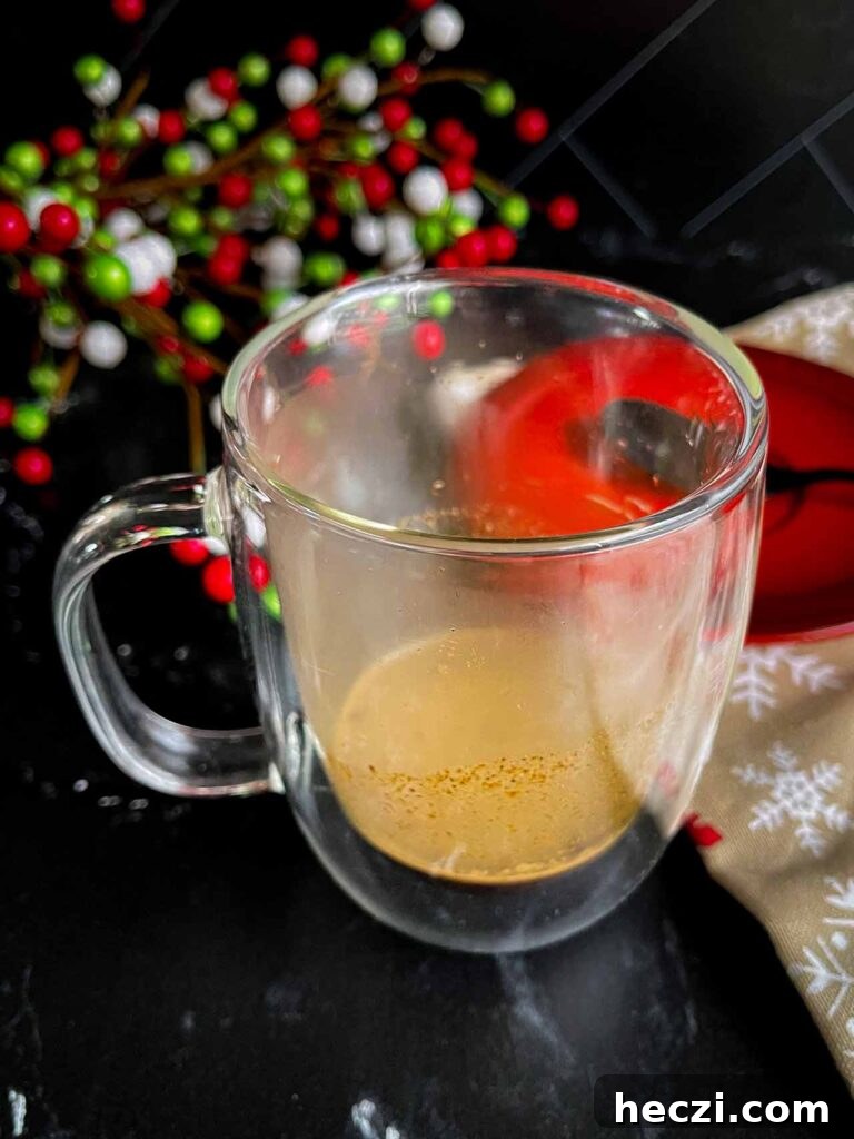 Homemade Holiday Spice Flat White Recipe 6 Espresso shot pulled over the holiday spice flat white spice mixture in the glass mug.