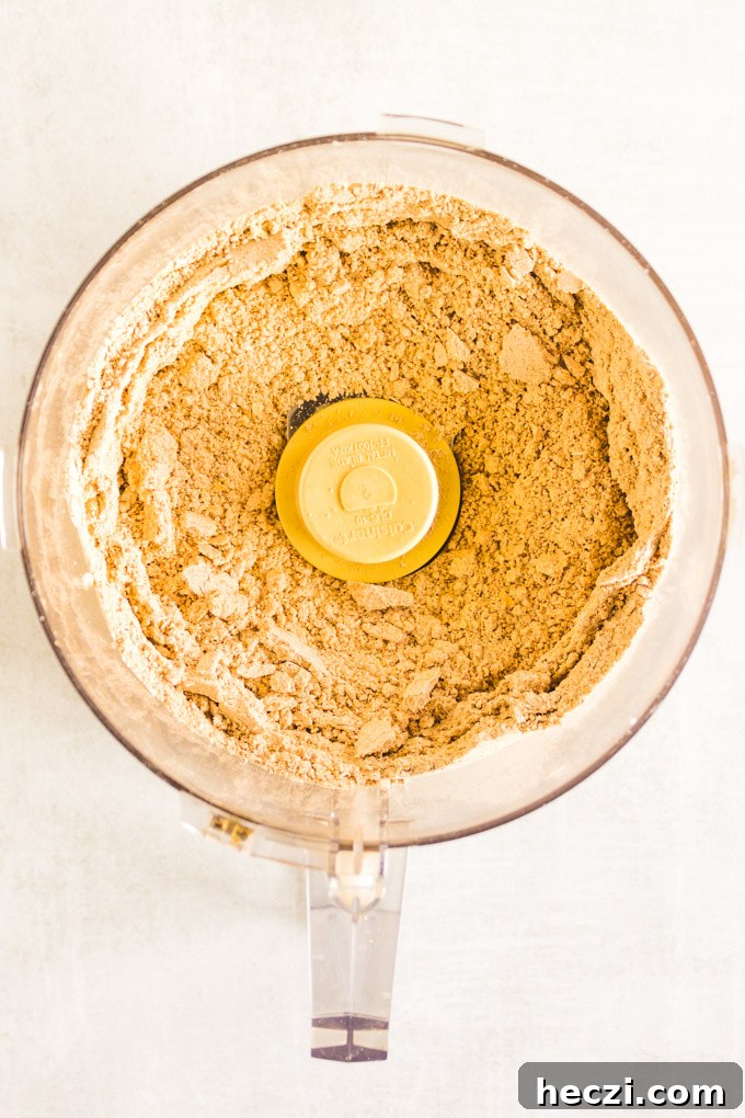 Gluten-Free Gingerbread Pear Muffins — Moist Spiced Breakfast Treat 4 Batter with chopped pears being folded in.