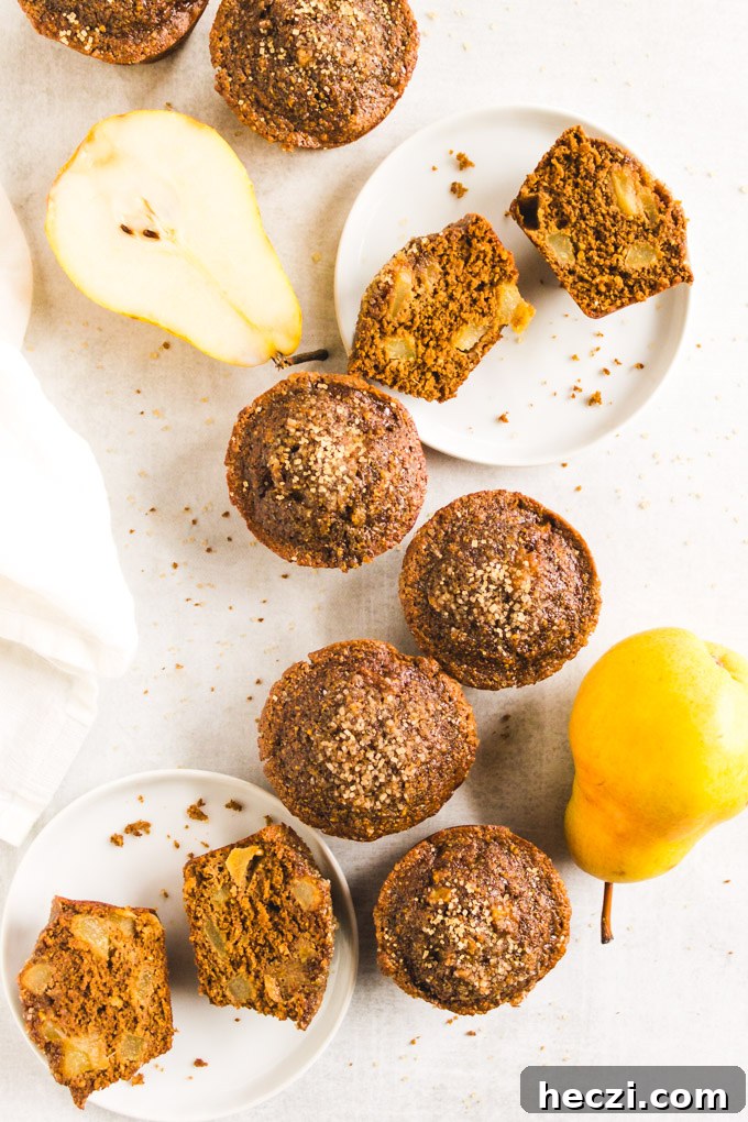 Gluten-Free Gingerbread Pear Muffins — Moist Spiced Breakfast Treat 8 Freshly baked gingerbread pear muffins.