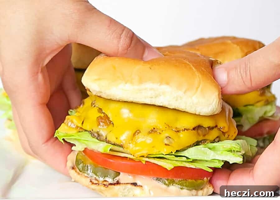 picking up one of the Double-Double Animal Style Burgers
