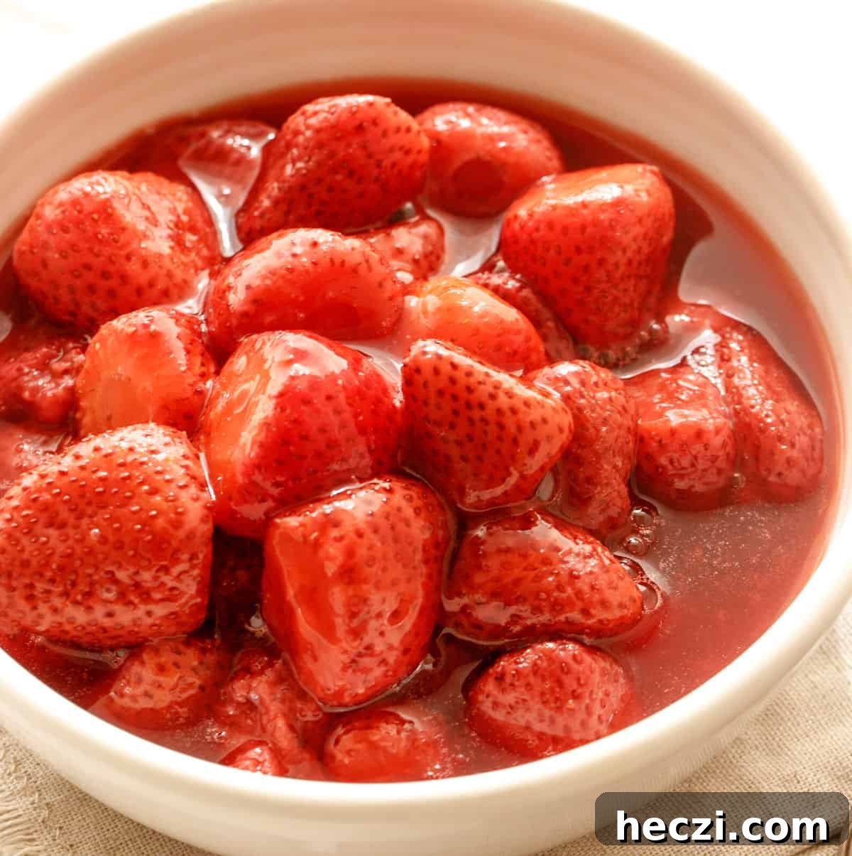 4-Ingredient Strawberry Compote Recipe for Fresh Homemade Jam 3 White bowl with strawberry compote.