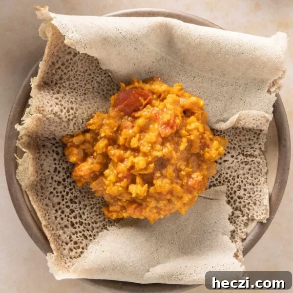 Close up of Misir Wot on injera flatbread on a plate